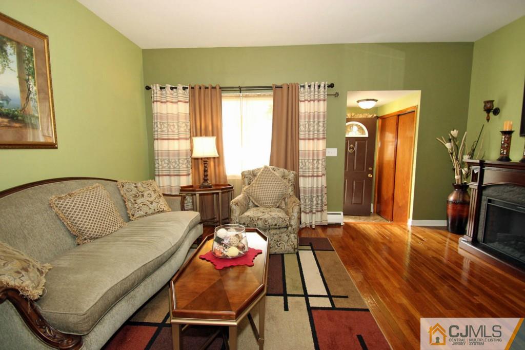 67 Brandywine Road Fords, NJ 08863 - Photo 7 of 25 a living room with furniture and a table