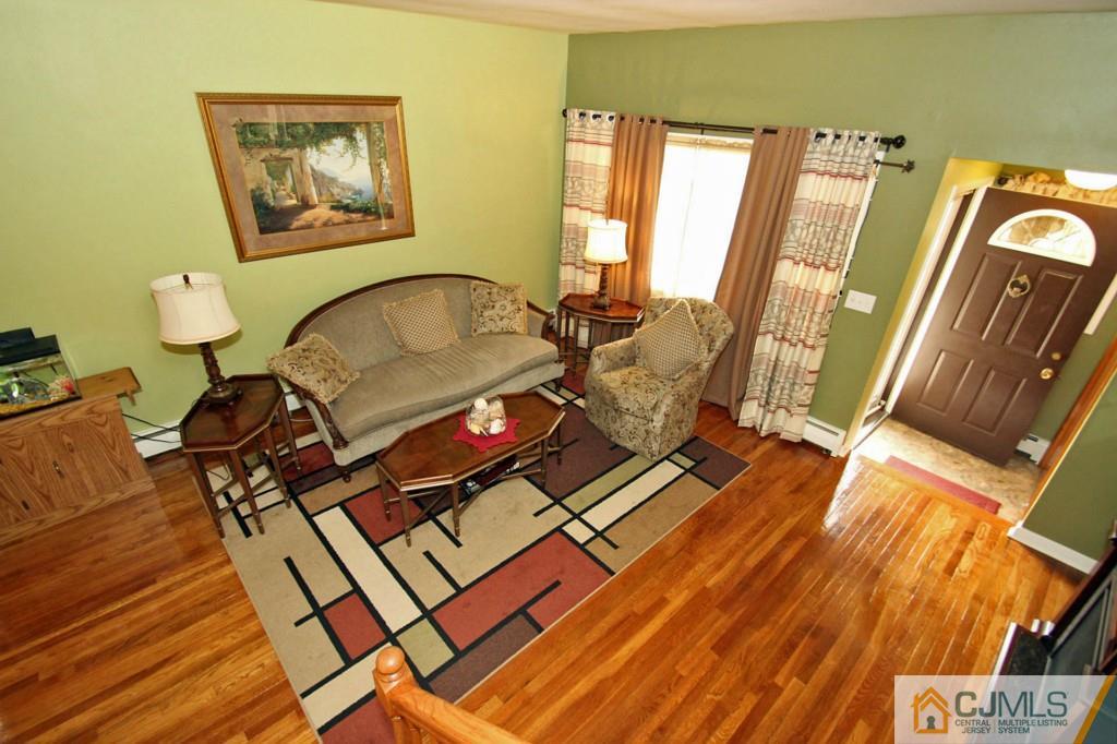 67 Brandywine Road Fords, NJ 08863 - Photo 8 of 25 a living room with a couch and a table