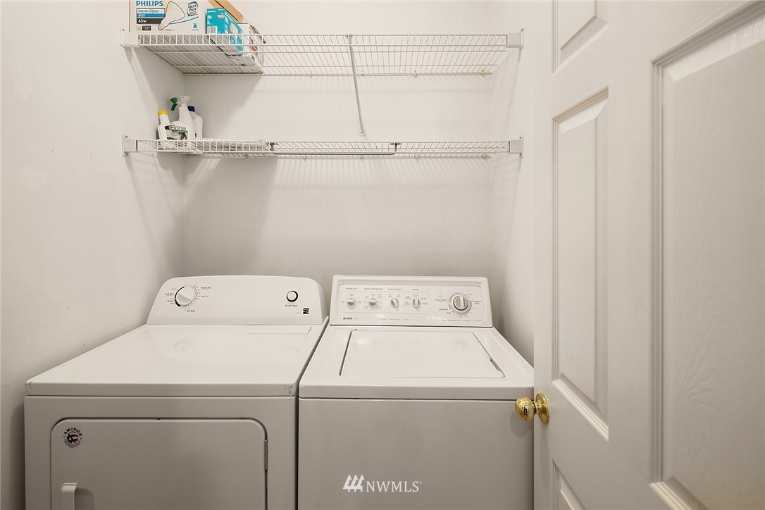 10909 Avondale Road Northeast, Unit F122 Redmond, WA 98052 - Photo 17 of 24 a utility room with dryer and washer
