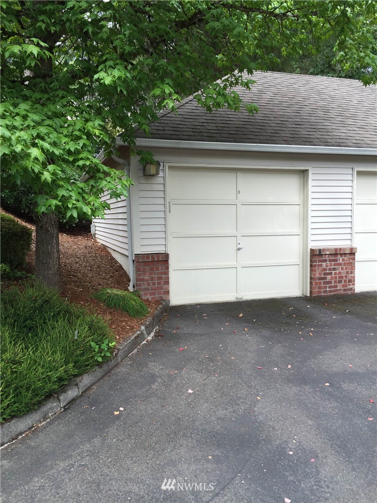 10909 Avondale Road Northeast, Unit F122 Redmond, WA 98052 - Photo 23 of 24 a view of backyard and garage