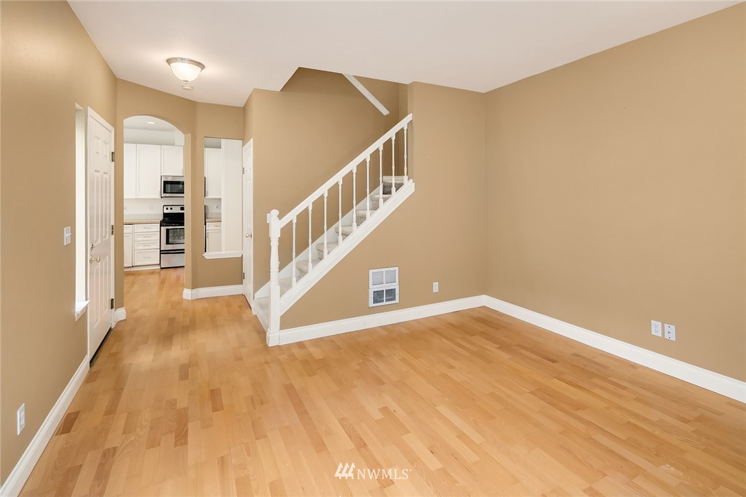 10909 Avondale Road Northeast, Unit F122 Redmond, WA 98052 - Photo 9 of 24 a view of an entryway with wooden floor
