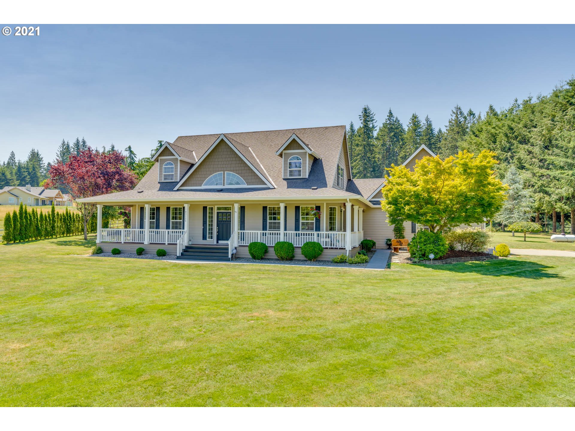 a front view of house with outdoor space and garden