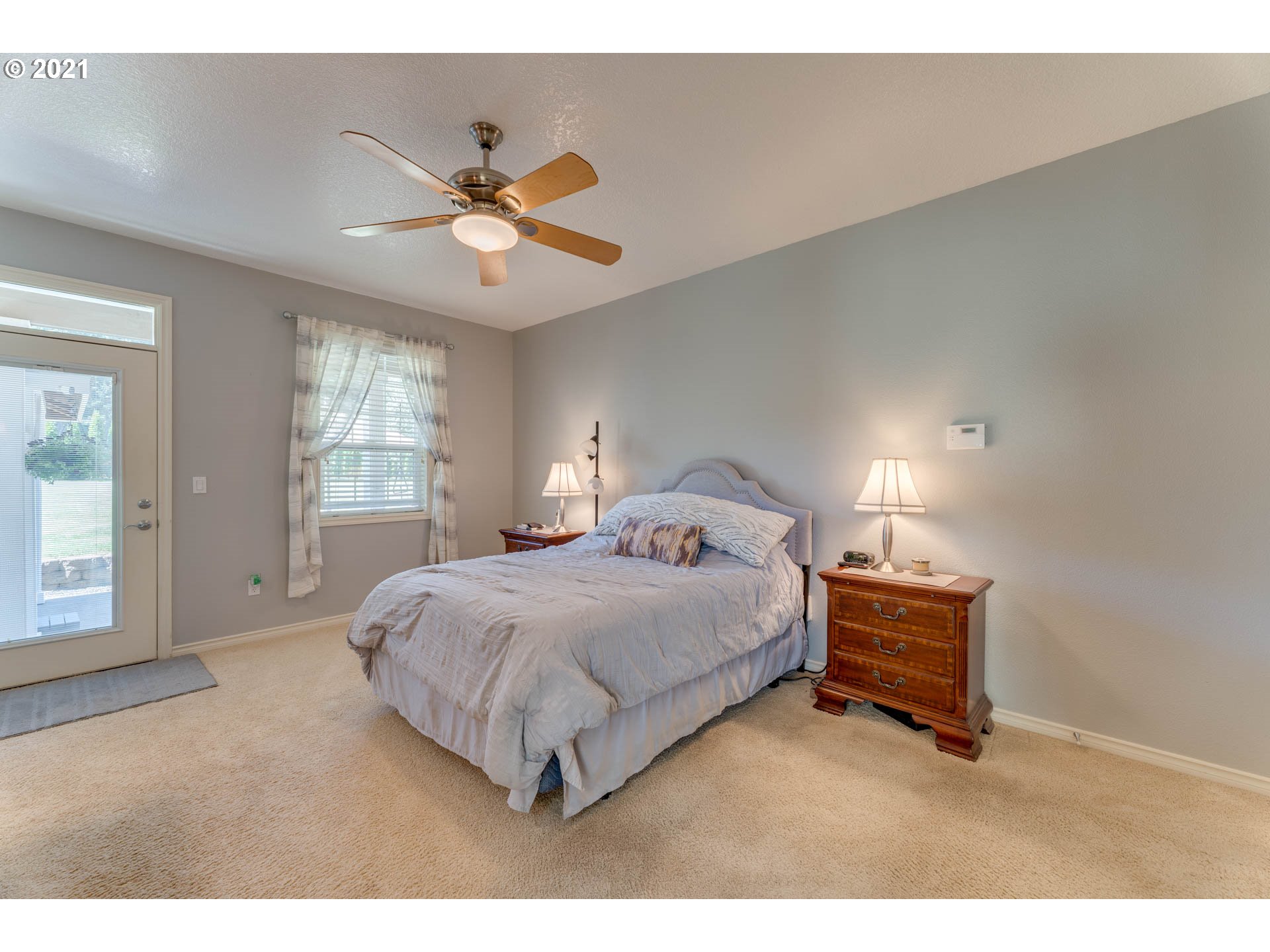 43126 Southeast Music Camp Road Sandy, OR 97055 - Photo 13 of 32 a bedroom with a bed chandelier and a window
