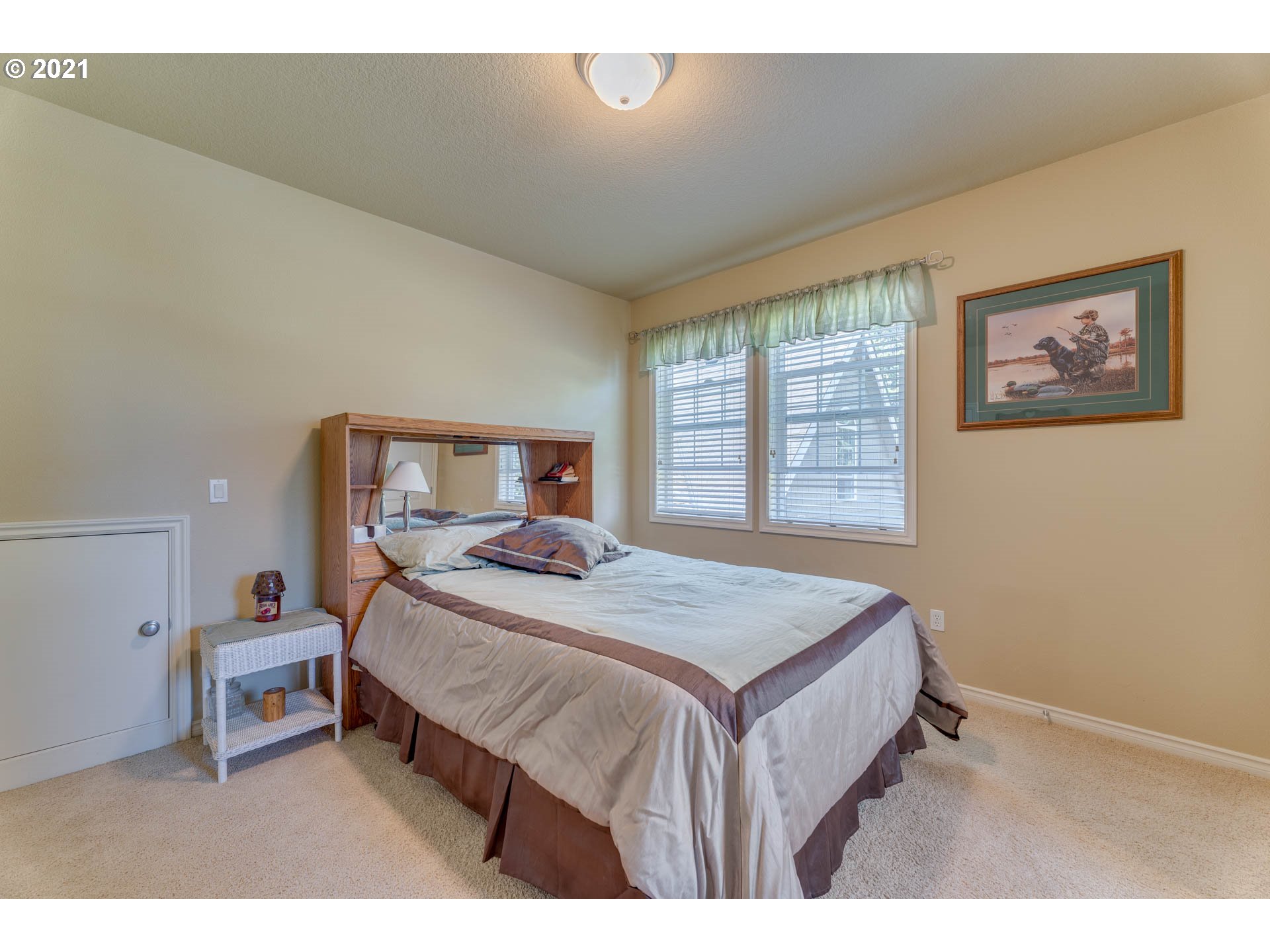 43126 Southeast Music Camp Road Sandy, OR 97055 - Photo 19 of 32 a bedroom with a bed a dresser and a window