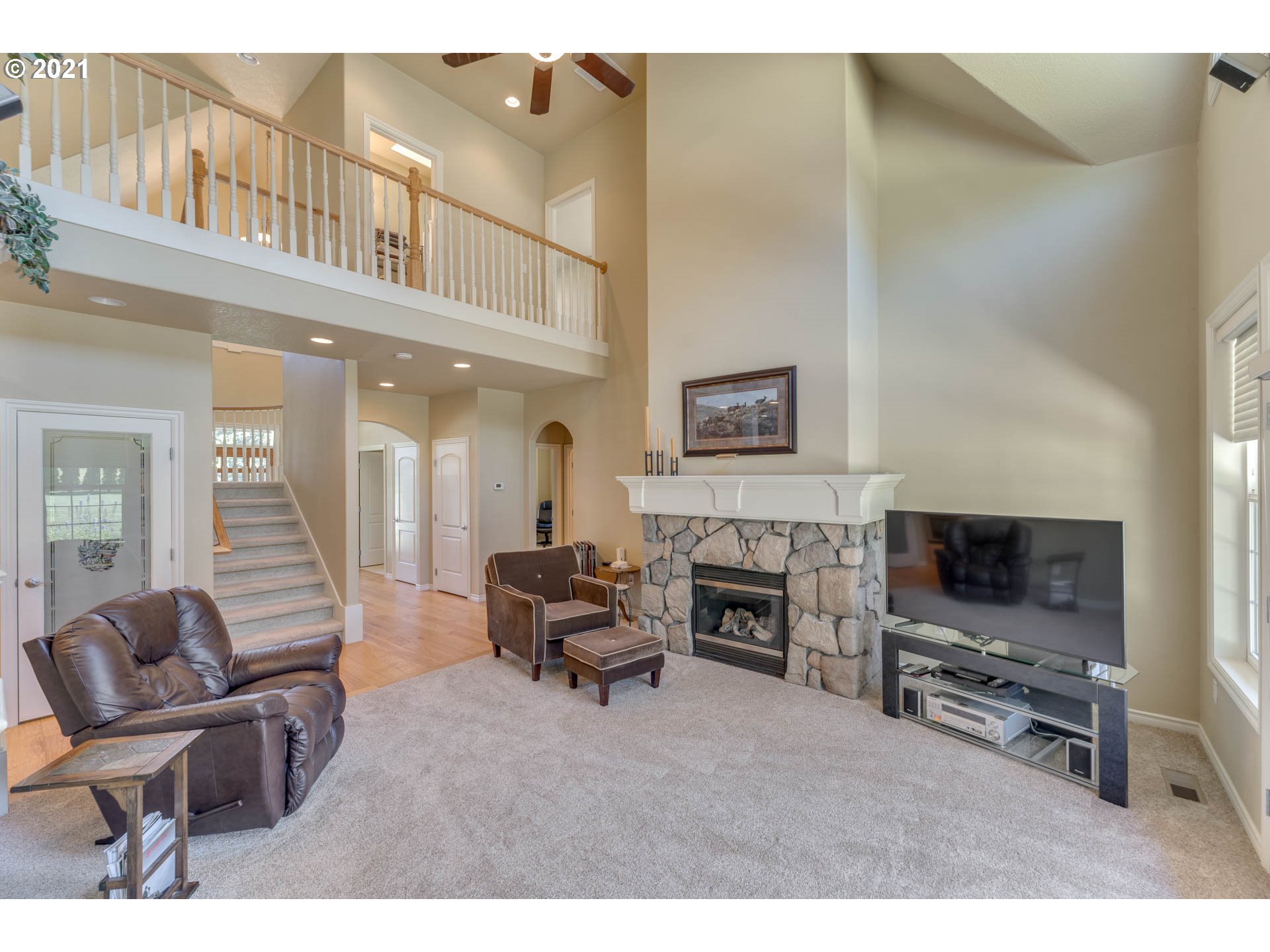43126 Southeast Music Camp Road Sandy, OR 97055 - Photo 5 of 32 a living room with furniture a flat screen tv and a fireplace