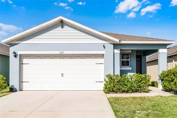 a front view of a house with a garage