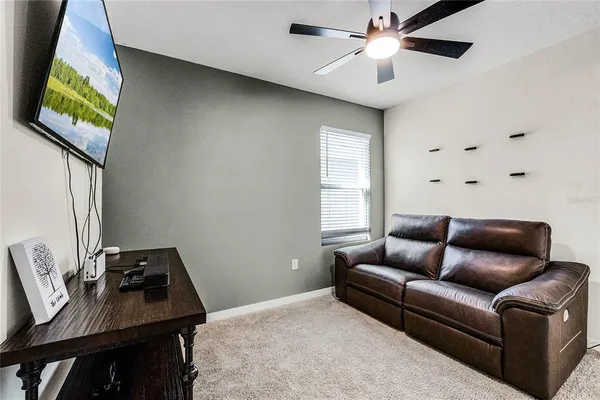 a living room with furniture and a window