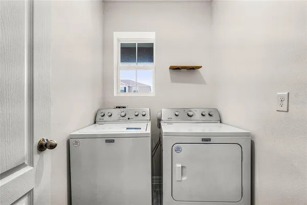 a utility room with dryer and washer