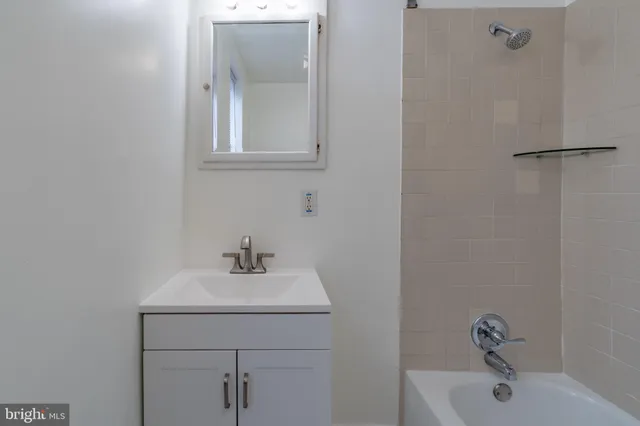 a bathroom with a sink a vanity and a mirror