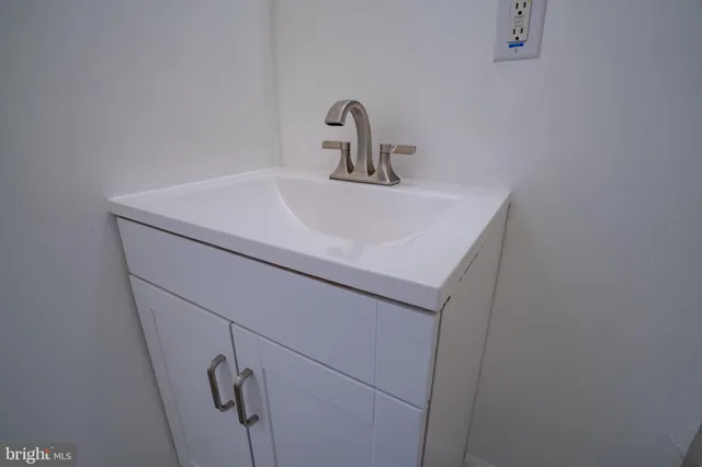 a close view of a sink and vanity in a bathroom