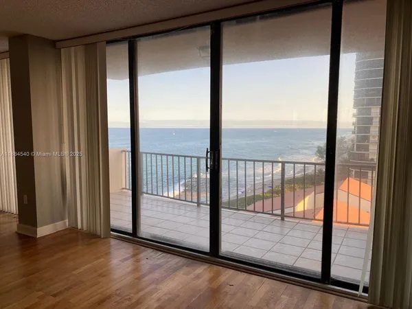 a view of a glass door and an outdoor space