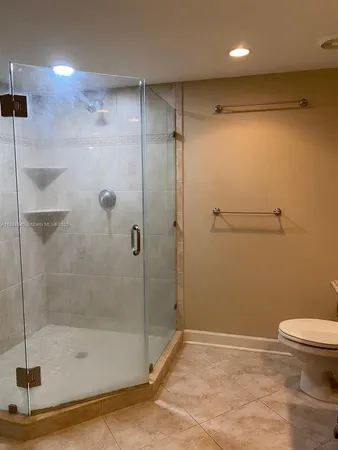 a bathroom with a shower and a toilet