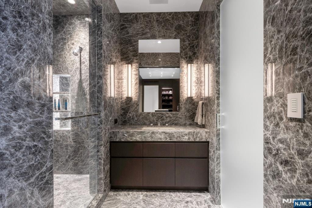 38 Rio Vista Drive Alpine, NJ 07620 - Photo 22 of 39 a bathroom with a granite countertop sink and a mirror