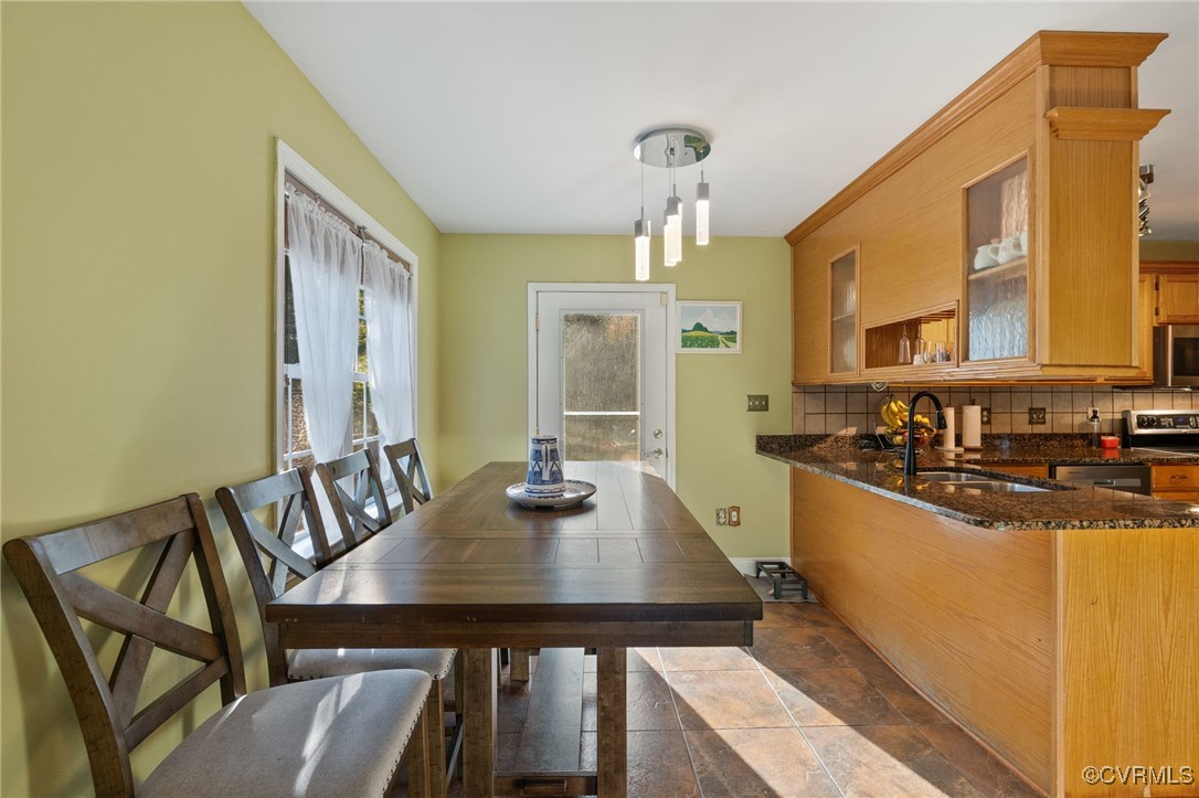 4212 Stigall Drive Chesterfield, VA 23112 - Photo 12 of 35 a view of a dining table and chairs