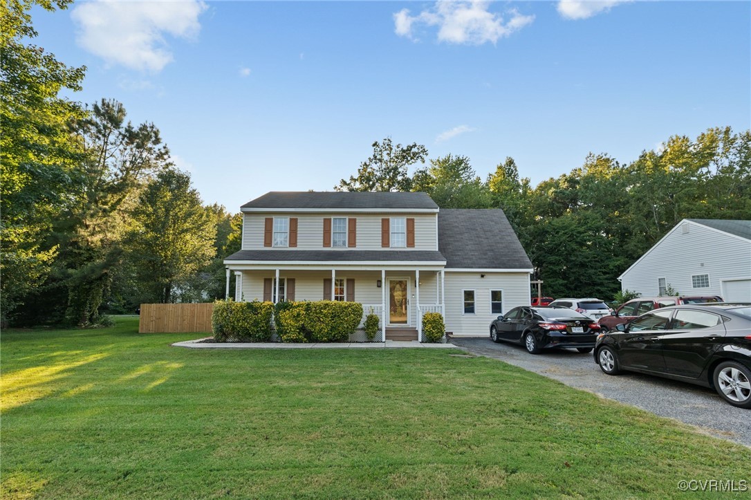4212 Stigall Drive Chesterfield, VA 23112 - Photo 2 of 35 a front view of a house with a garden