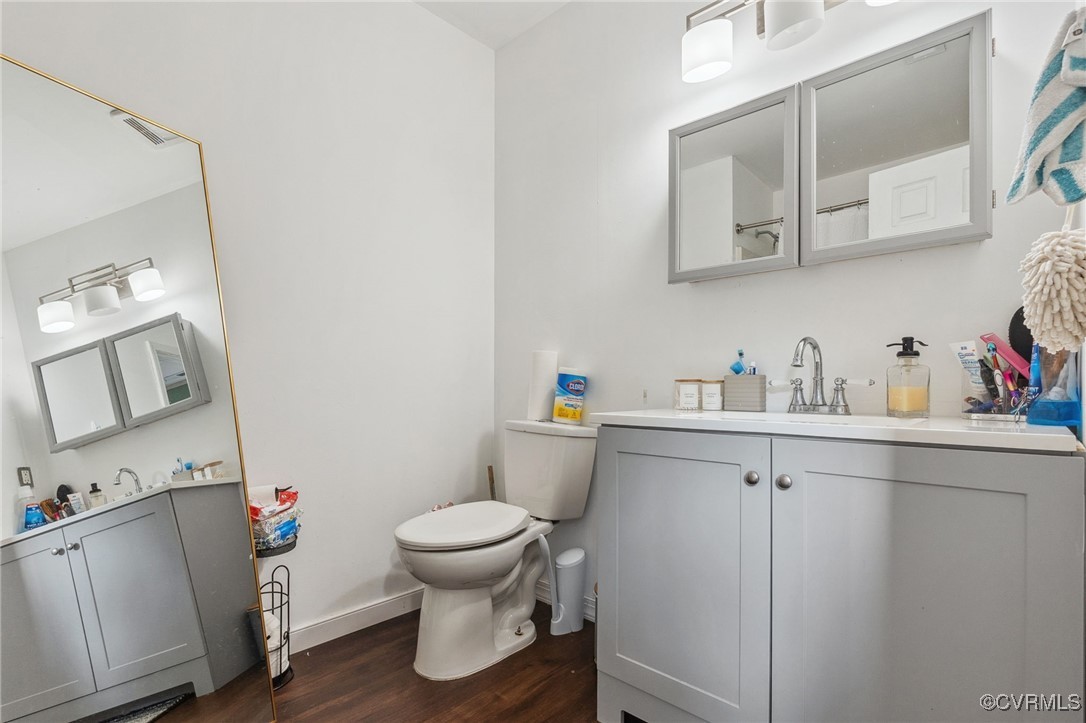 4212 Stigall Drive Chesterfield, VA 23112 - Photo 23 of 35 a bathroom with a sink toilet and a mirror