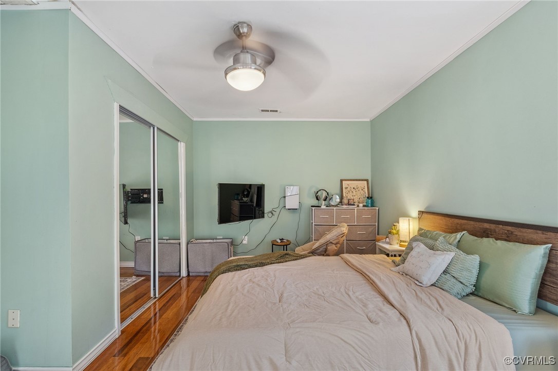 4212 Stigall Drive Chesterfield, VA 23112 - Photo 27 of 35 a bedroom with a bed and a flat tv screen on dresser