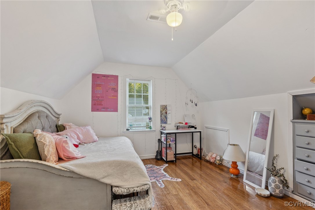 4212 Stigall Drive Chesterfield, VA 23112 - Photo 28 of 35 a bedroom with a bed and wooden floor