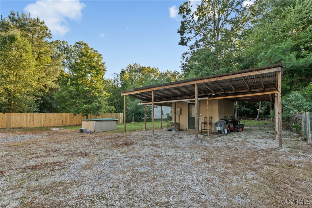 4212 Stigall Drive Chesterfield, VA 23112 - Photo 32 of 35 a view of wooden house with a backyard and wooden fence