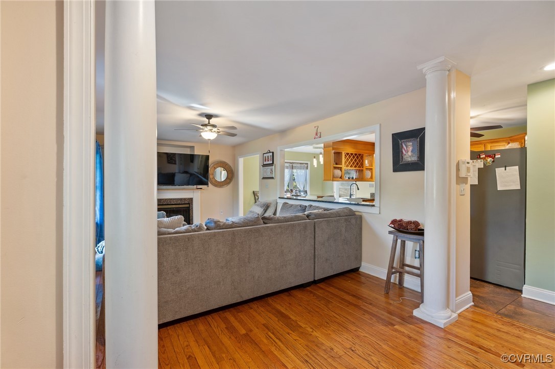 4212 Stigall Drive Chesterfield, VA 23112 - Photo 7 of 35 a living room with stainless steel appliances kitchen island granite countertop furniture and a wooden floor