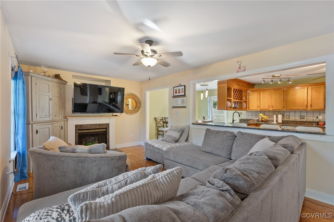 4212 Stigall Drive Chesterfield, VA 23112 - Photo 8 of 35 a living room with furniture and a fireplace