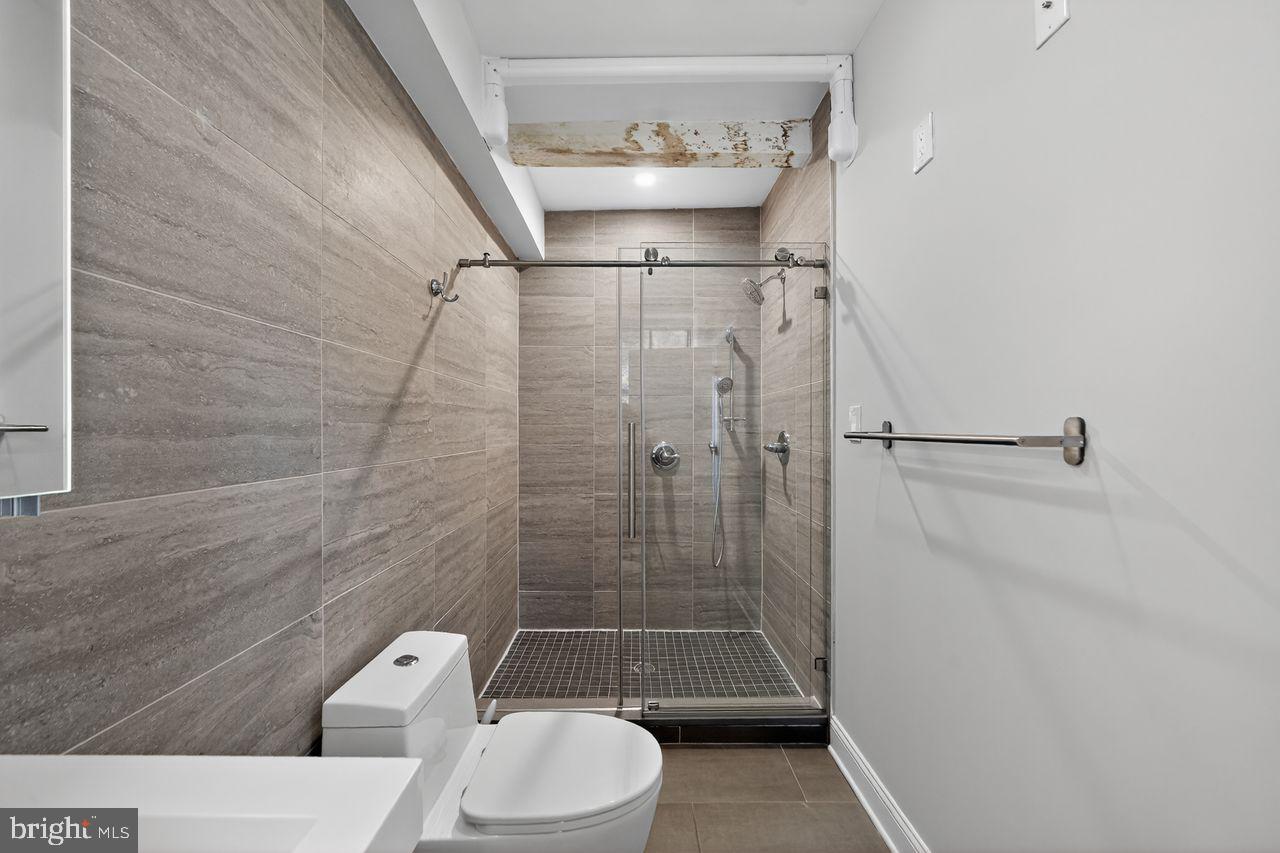 236 South 21st Street, Unit CD Philadelphia, PA 19103 - Photo 19 of 27 a bathroom with a toilet and a shower