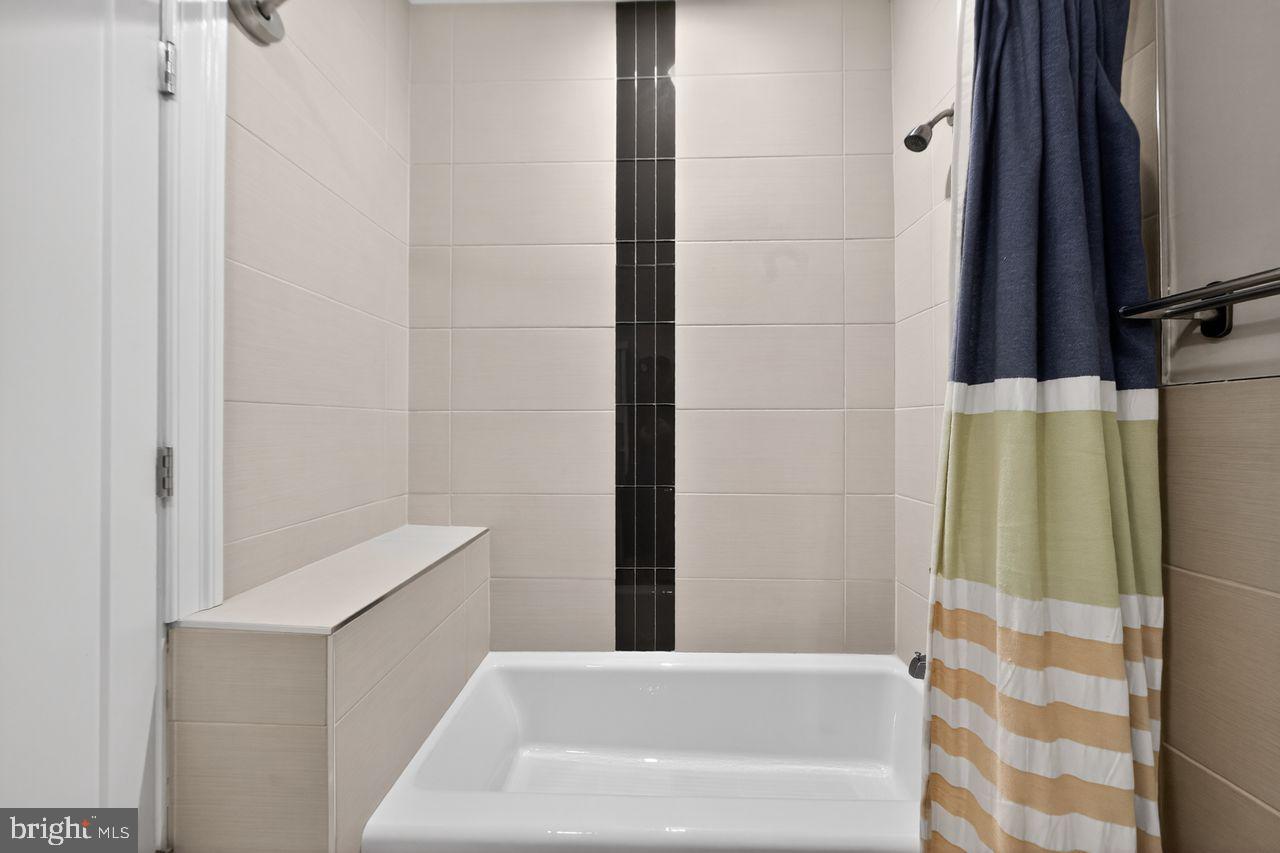 236 South 21st Street, Unit CD Philadelphia, PA 19103 - Photo 22 of 27 a bathroom with a bathtub and a shower