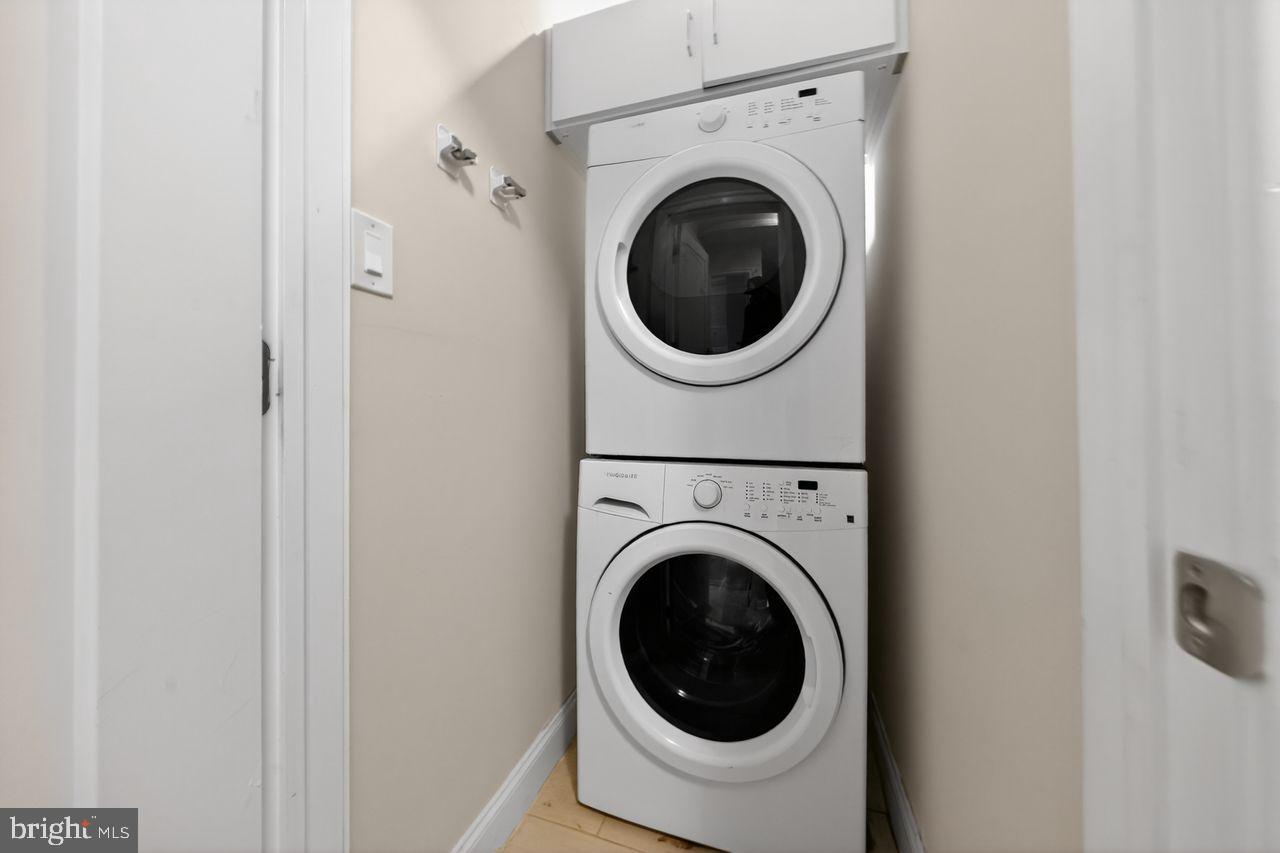 236 South 21st Street, Unit CD Philadelphia, PA 19103 - Photo 24 of 27 a close up view of a washer and dryer