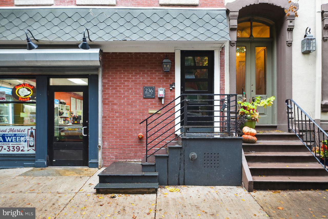 236 South 21st Street, Unit CD Philadelphia, PA 19103 - Photo 3 of 27 a front view of a house with a yard