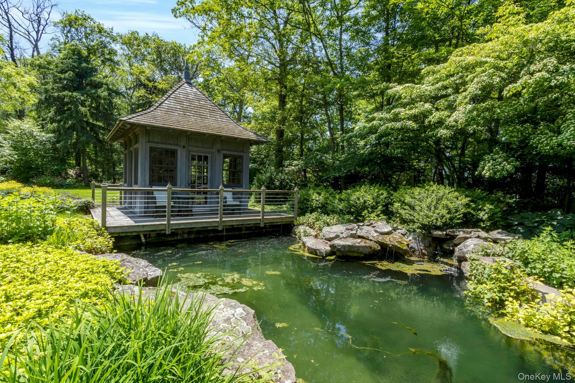 120 Ridge Road Tuxedo Park, NY 10987 - Photo 40 of 50 View of property's community featuring a small pond and a deck