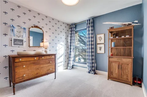 a room with chandelier and furniture