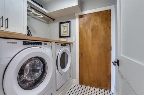 a view of a hallway with washer and dryer