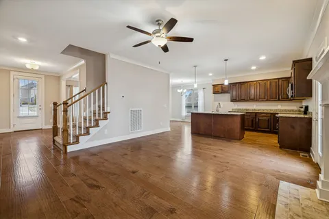 a bathroom with a double vanity sink a mirror a shower and a bathtub