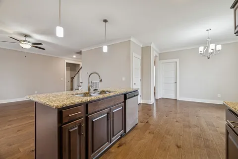 a view of an empty room with a ceiling fan