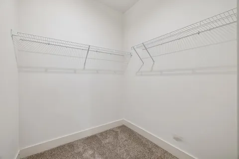 an empty room with closet area