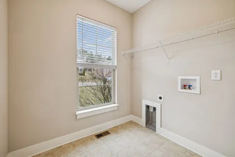an aerial view of a house with a yard and balcony