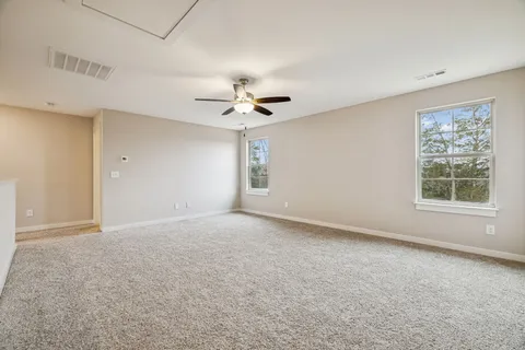 a view of backyard with a deck