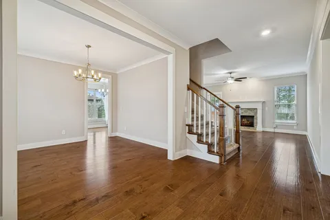 a kitchen with a sink a counter space and a refrigerator