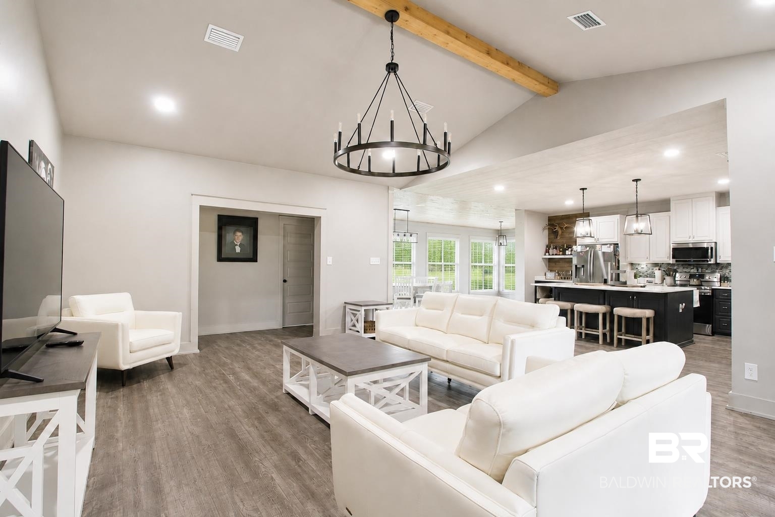 9825 Wolf Creek Ridge Elberta, AL 36530 - Photo 39 of 76 Spacious living area featuring vaulted ceilings with exposed beam, recessed lighting, and wood-finish flooring
