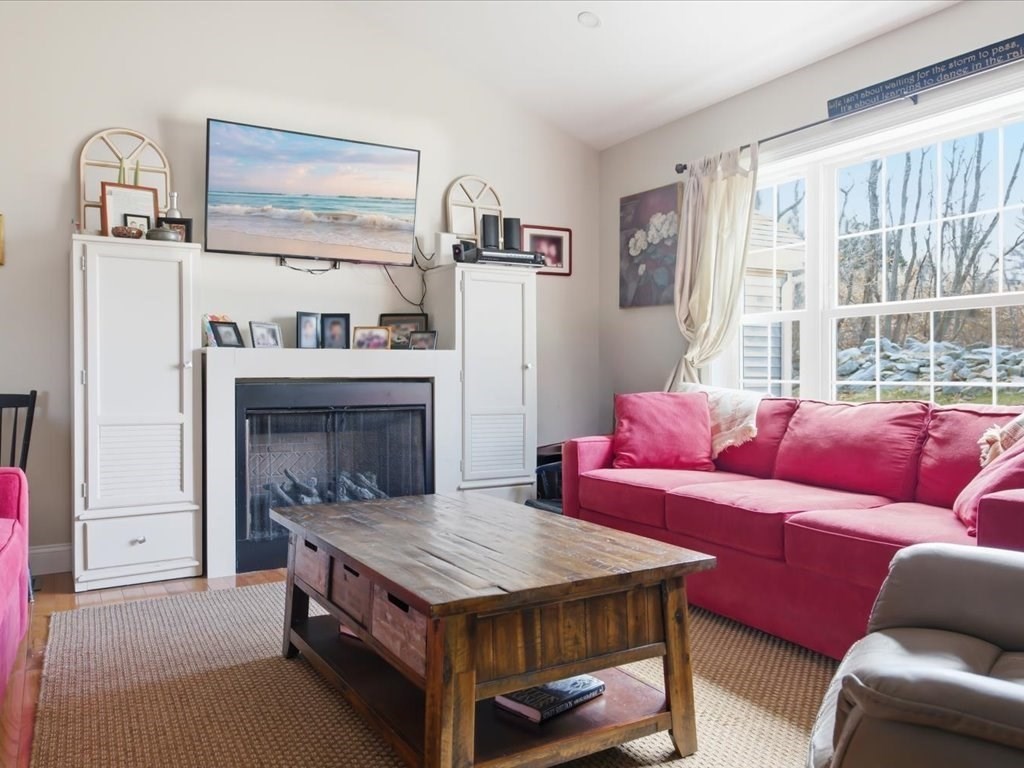 67 Ling Street Fall River, MA 02720 - Photo 8 of 32 a living room with furniture and a fireplace