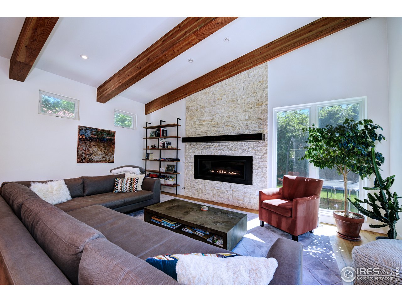 2930 18th Street Boulder, CO 80304 - Photo 14 of 40 a living room with furniture potted plant and a fireplace