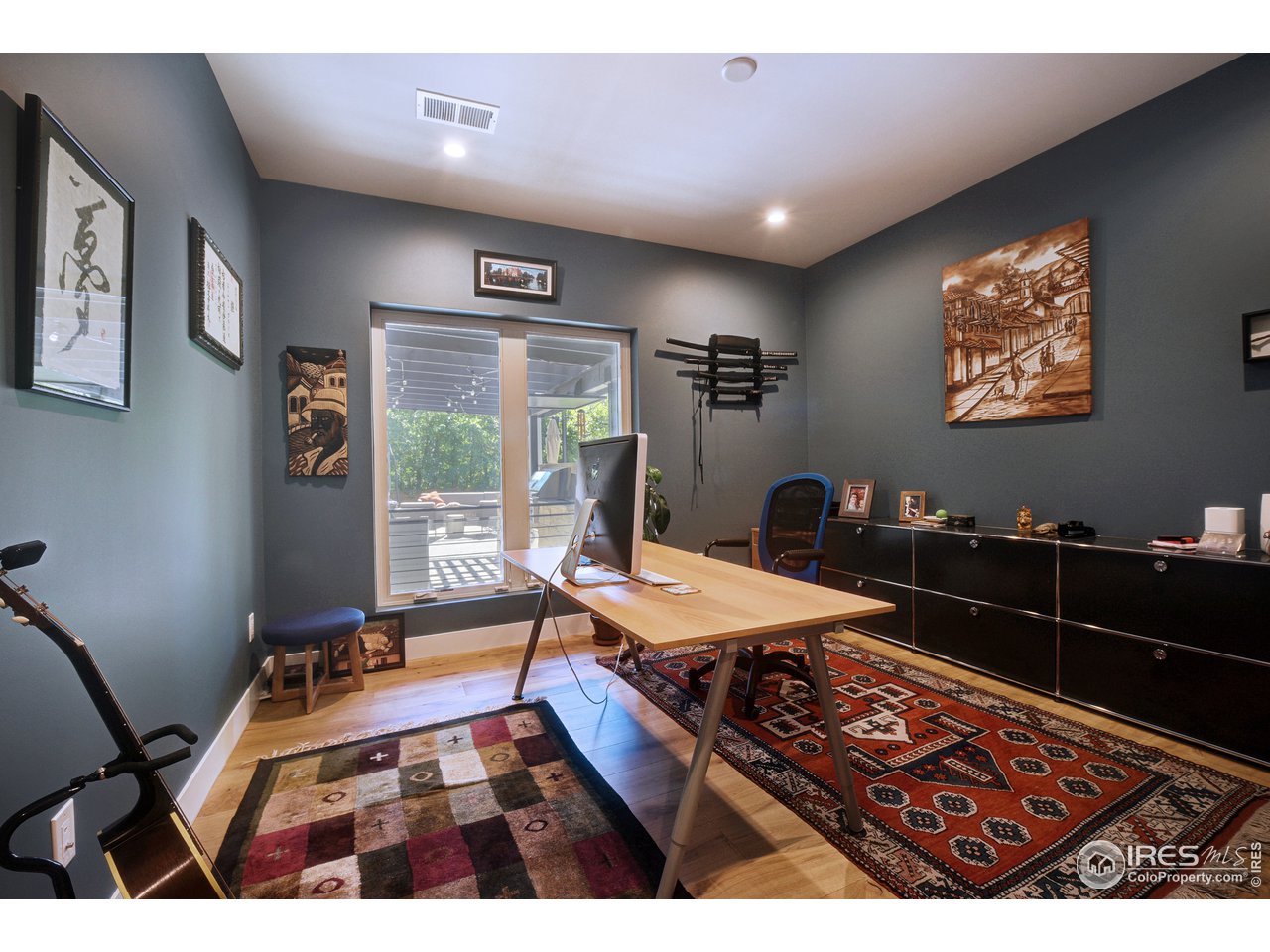 2930 18th Street Boulder, CO 80304 - Photo 15 of 40 a room with furniture a flat screen tv and a table