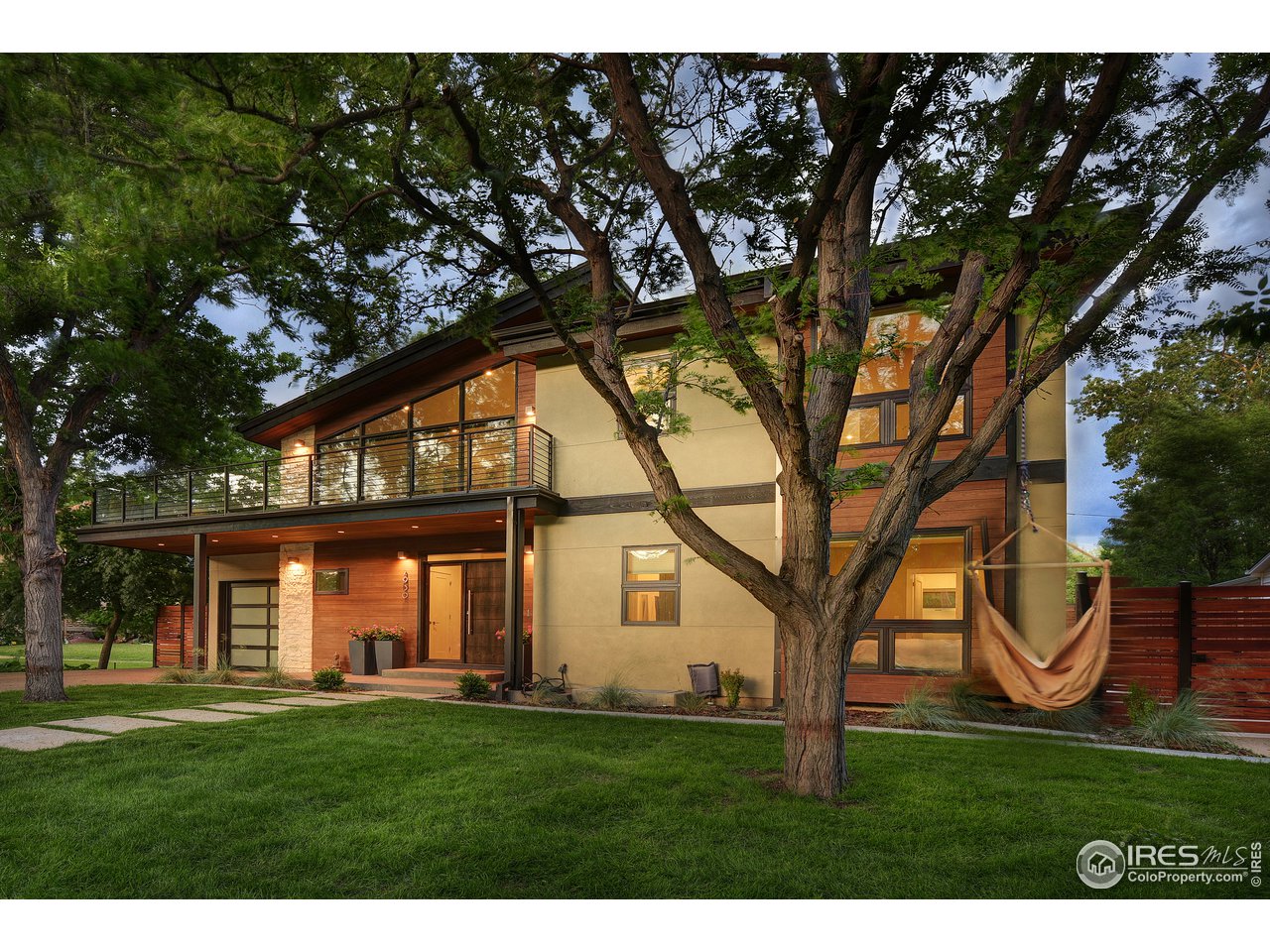 2930 18th Street Boulder, CO 80304 - Photo 2 of 40 a backyard of a house with barbeque oven garden and trees