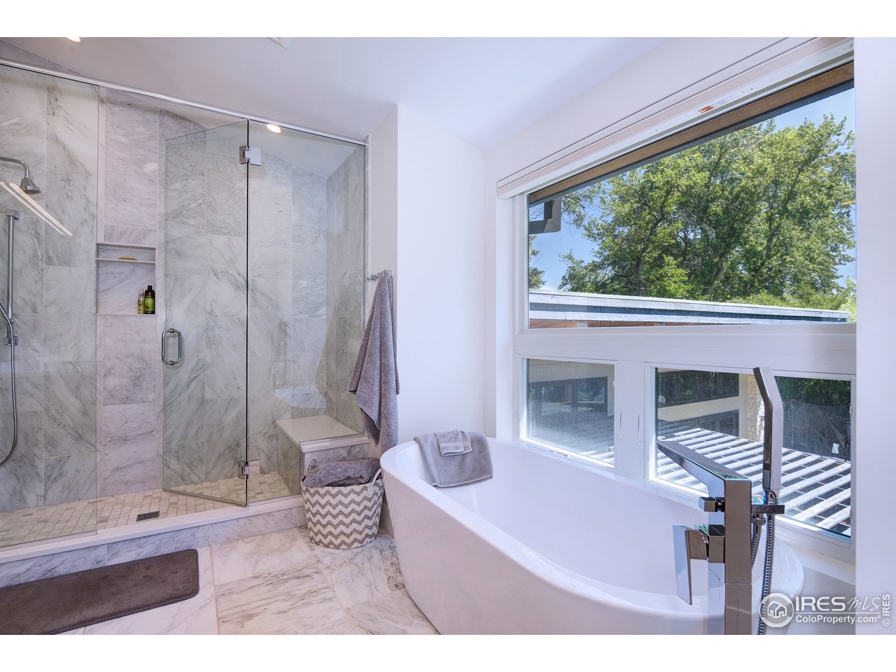 2930 18th Street Boulder, CO 80304 - Photo 23 of 40 a bathroom with a bathtub shower and a sink