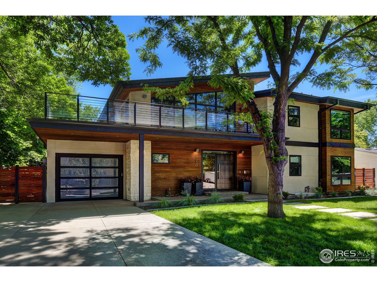 2930 18th Street Boulder, CO 80304 - Photo 3 of 40 a front view of a house with garden