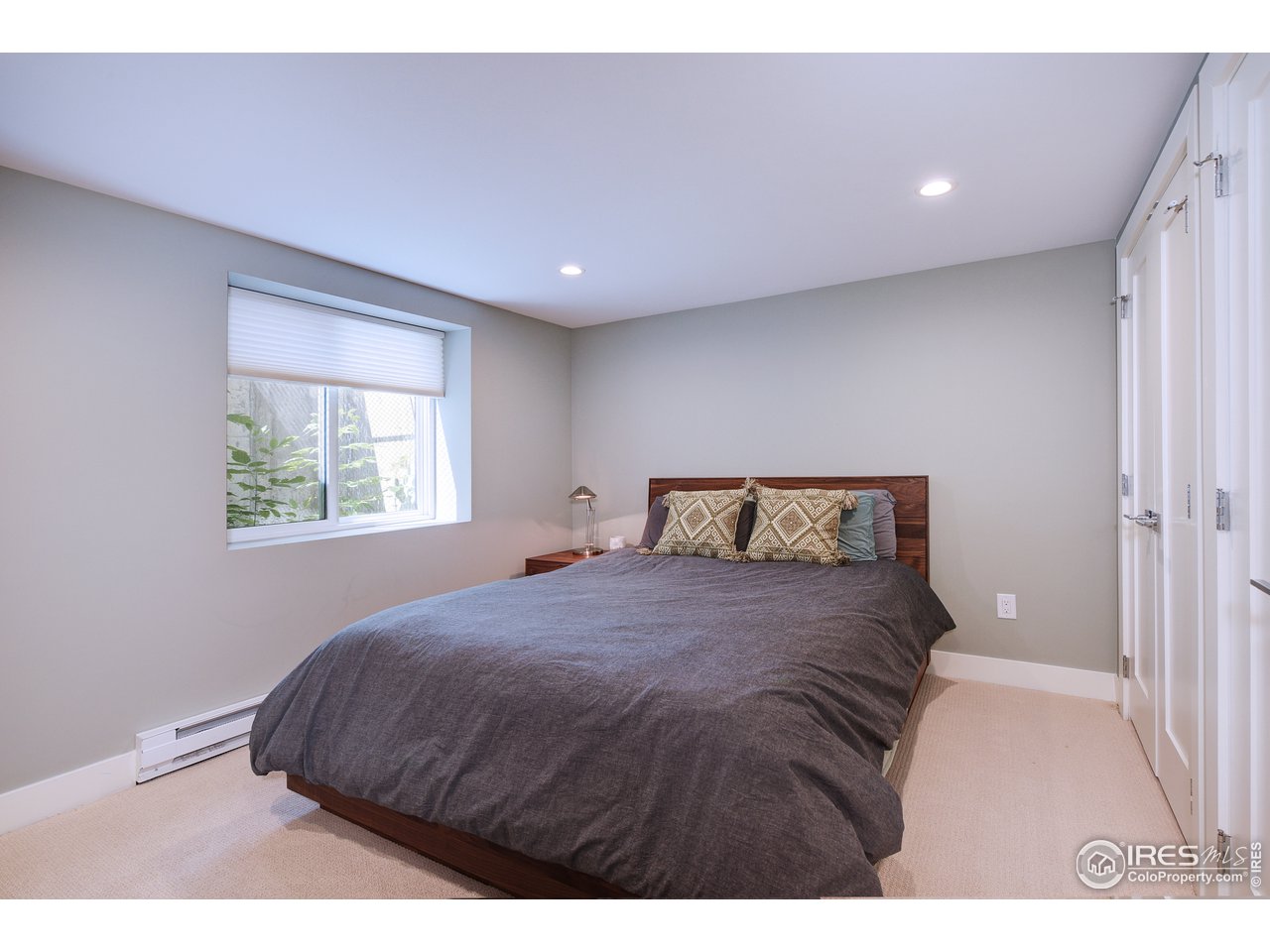 2930 18th Street Boulder, CO 80304 - Photo 31 of 40 a bedroom with a bed and a window