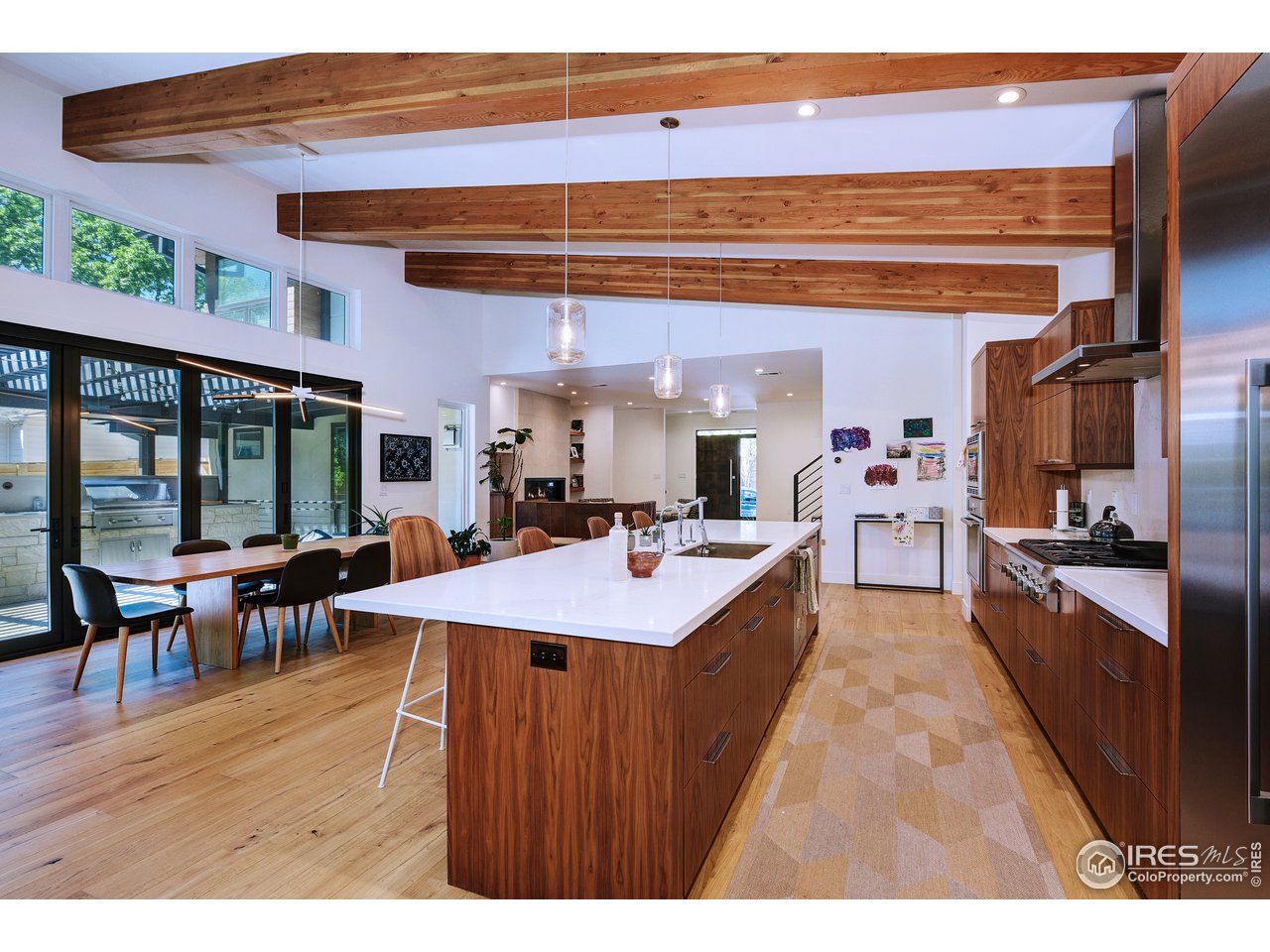 2930 18th Street Boulder, CO 80304 - Photo 9 of 40 a open kitchen with stainless steel appliances kitchen island granite countertop a sink and cabinets
