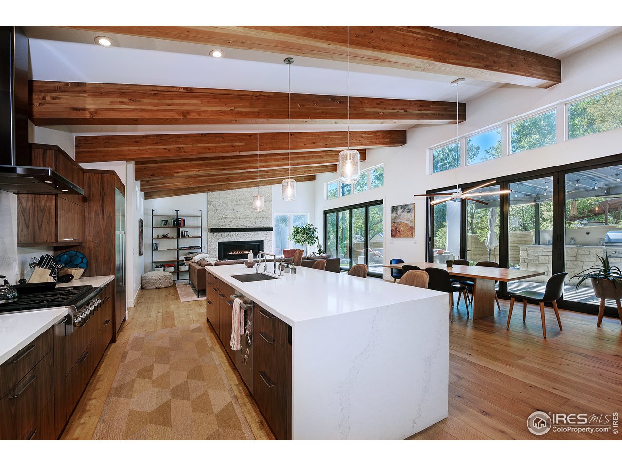 2930 18th Street Boulder, CO 80304 - Photo 10 of 40 a kitchen with a stove a refrigerator and chairs