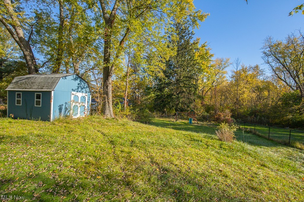 38095 Aurora Road Solon, OH 44139 - Photo 16 of 17 View of yard with a storage shed