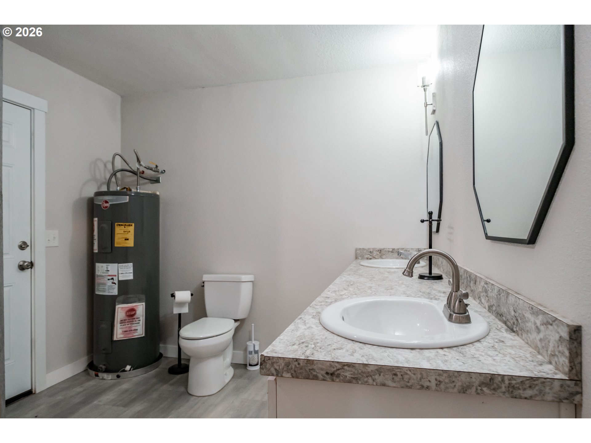 10471 Wagon Road Northeast Mount Angel, OR 97362 - Photo 17 of 48 a bathroom with a toilet sink and mirror
